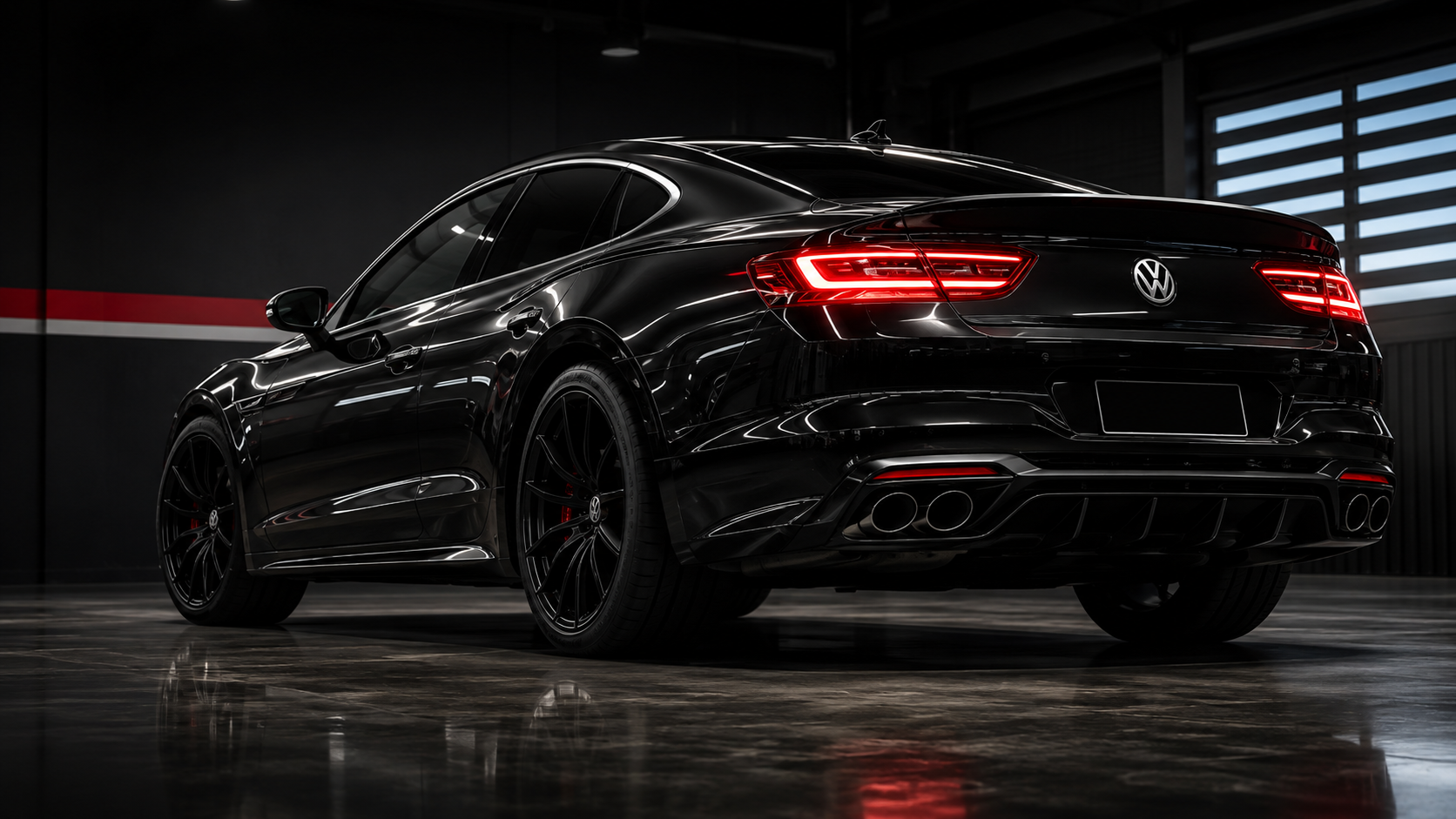 Black Volkswagen sports car inside a dark professional automotive shop